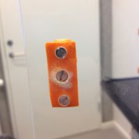 Extra screw in the handle for the magnet to attach to and a hole for the magnet 